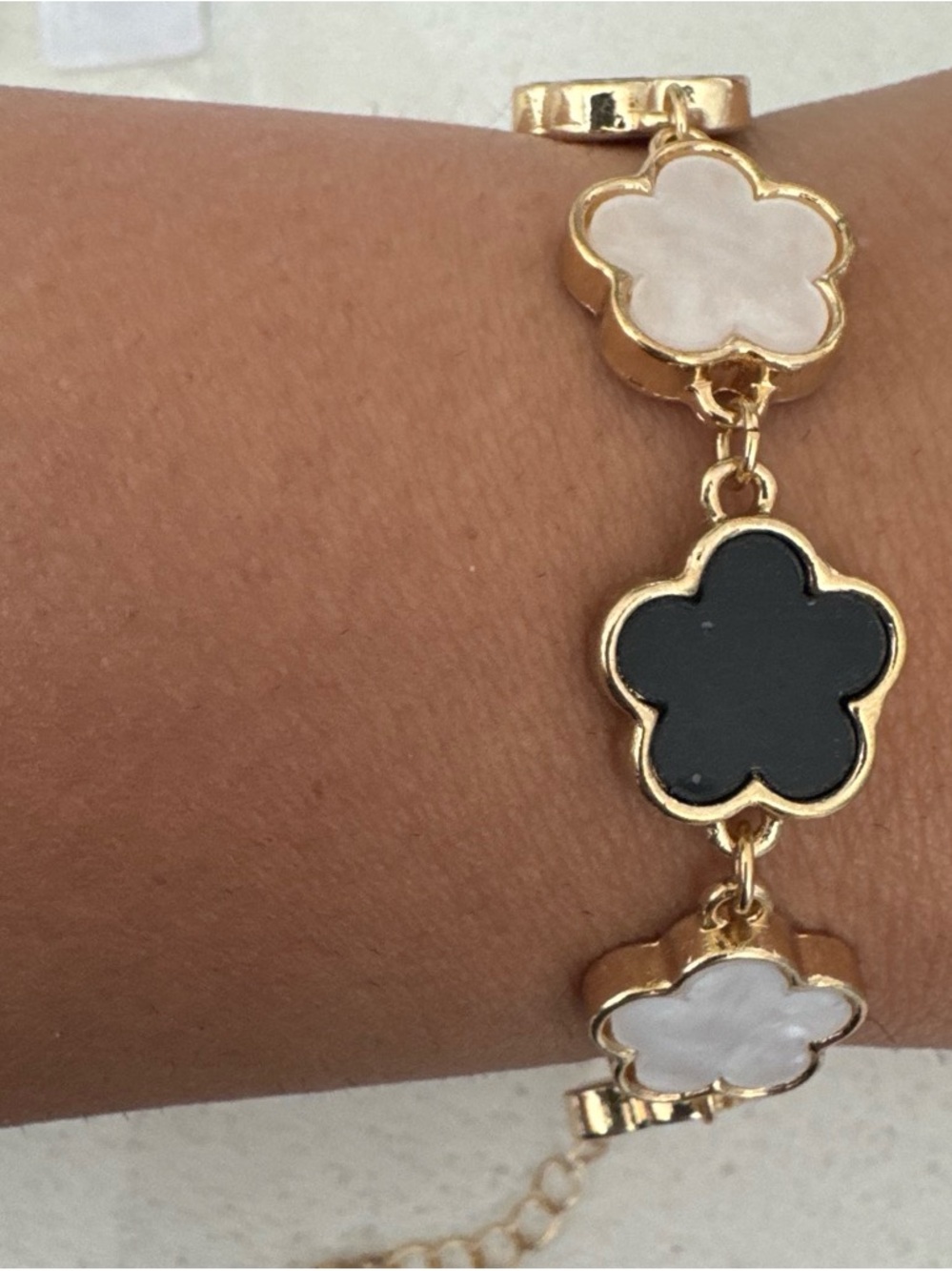 Gold Flower Link Bracelet with Black and White Enamel Accents